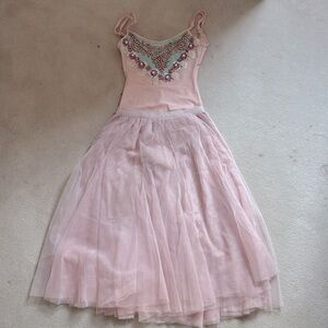 Ballet performance costume pink leotard with knee length skirt.